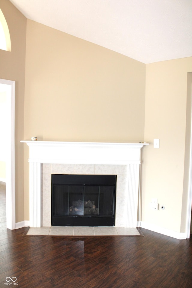 room details with hardwood / wood-style flooring and a fireplace