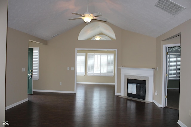 unfurnished living room with dark wood-type flooring, ceiling fan, and lofted ceiling