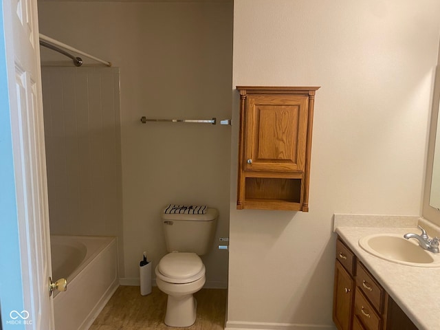 bathroom featuring toilet and vanity