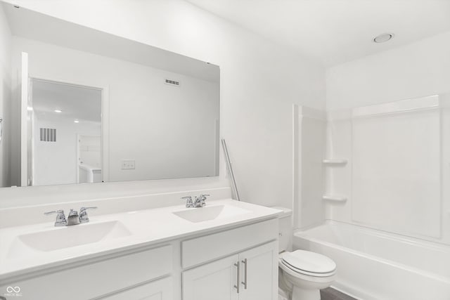 full bathroom with toilet, vanity, wood-type flooring, and washtub / shower combination