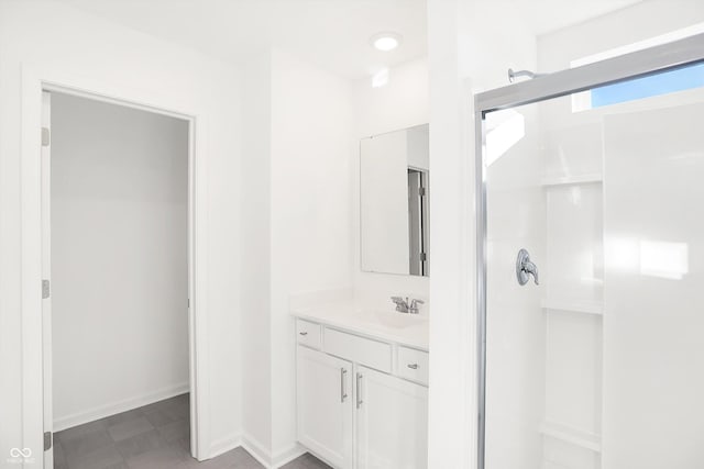 bathroom featuring vanity and walk in shower