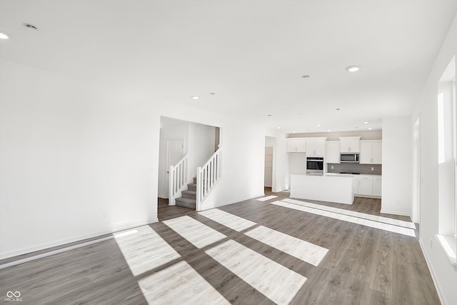 unfurnished living room with light wood-type flooring