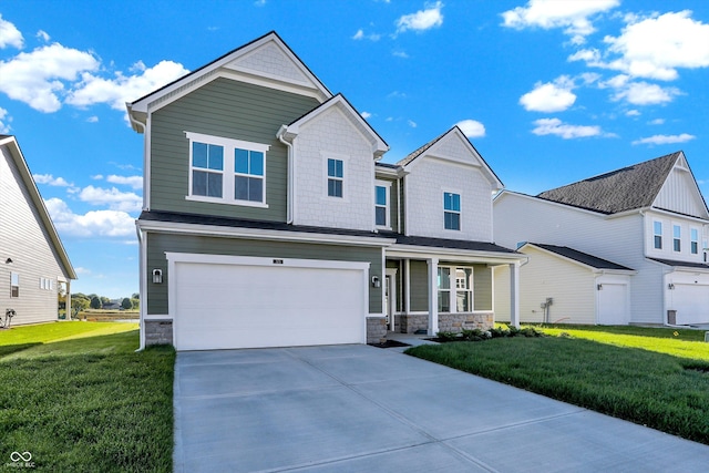 view of front of property featuring a front yard and a garage