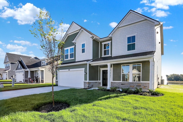 view of front of property featuring a garage and a front yard