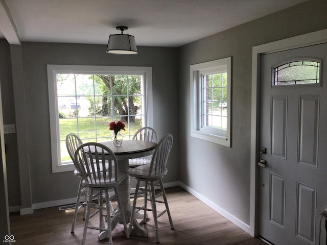 dining area featuring hardwood / wood-style flooring