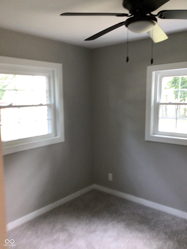 carpeted empty room with ceiling fan