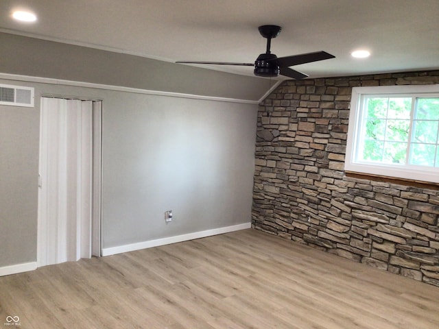 interior space featuring vaulted ceiling, ceiling fan, and light hardwood / wood-style floors