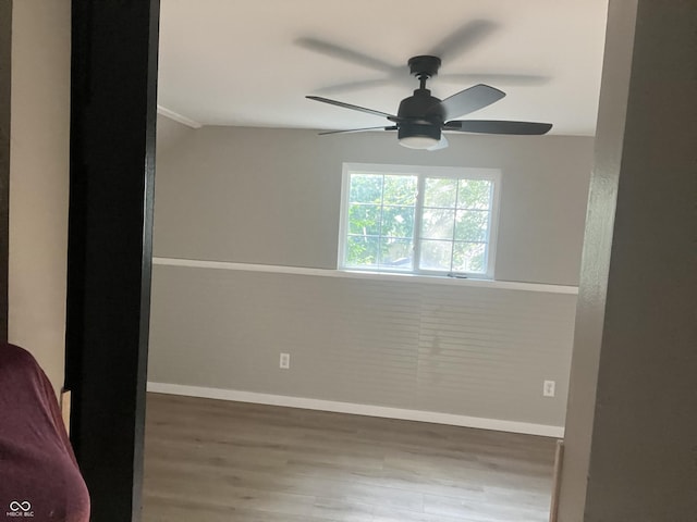 unfurnished room with hardwood / wood-style floors and ceiling fan