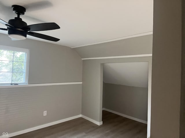 bonus room with lofted ceiling, dark hardwood / wood-style flooring, and ceiling fan