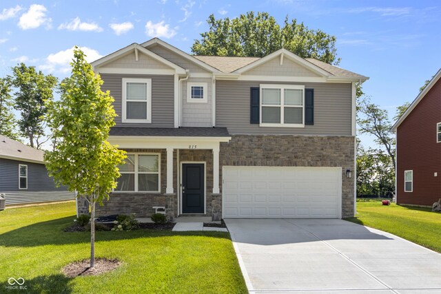 craftsman house featuring a front yard and a garage