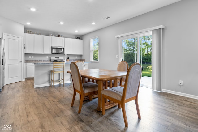 dining room with hardwood / wood-style flooring