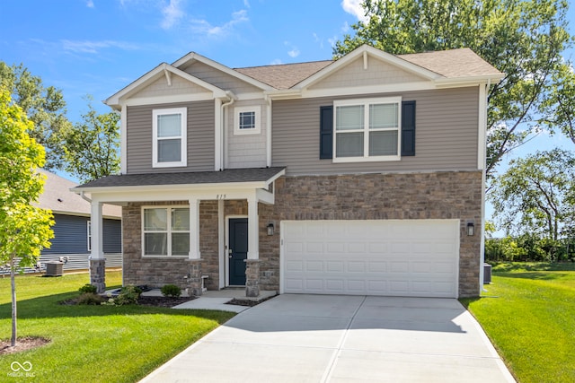 craftsman inspired home with a front yard, a garage, and central AC