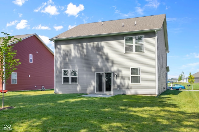 rear view of house with a yard