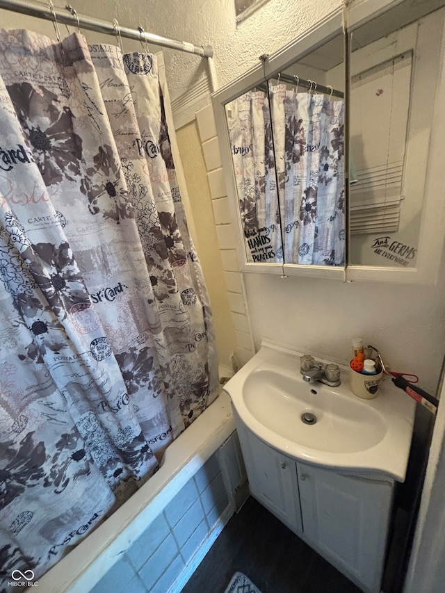 bathroom with vanity and shower / bath combo with shower curtain