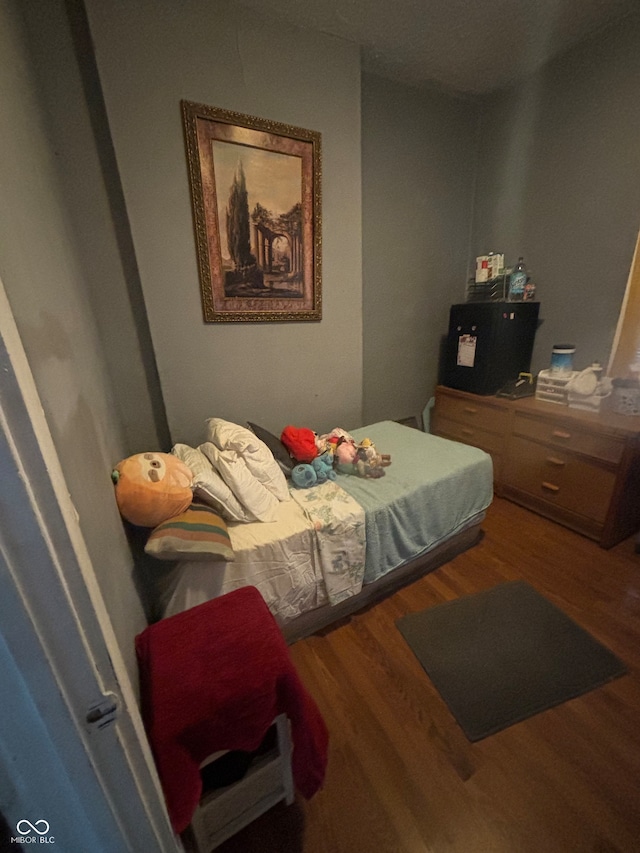 bedroom with hardwood / wood-style floors