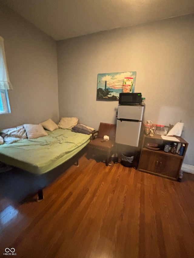 bedroom with hardwood / wood-style flooring