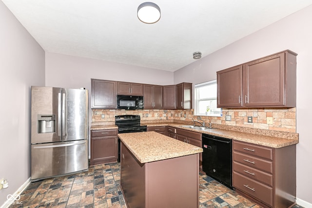 kitchen featuring black appliances, a center island, sink, and tasteful backsplash