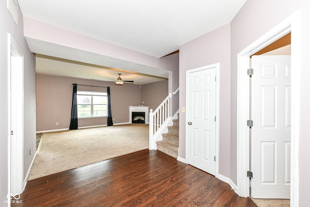 foyer with dark hardwood / wood-style floors and ceiling fan