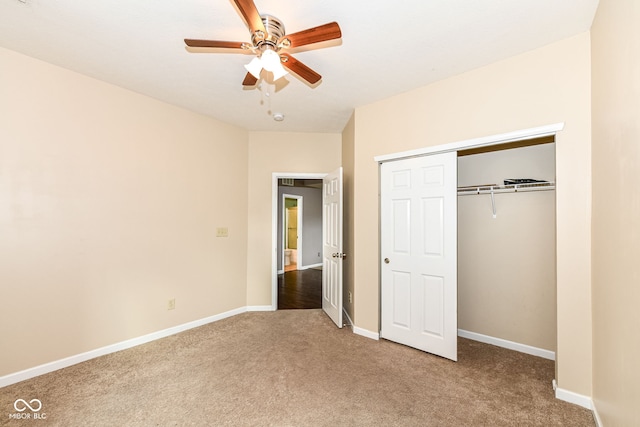 unfurnished bedroom featuring carpet, a closet, and ceiling fan