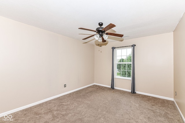 carpeted empty room with ceiling fan