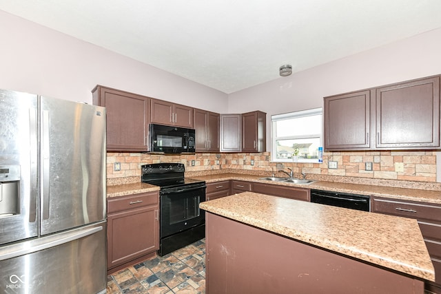 kitchen with sink, tasteful backsplash, dark brown cabinetry, and black appliances