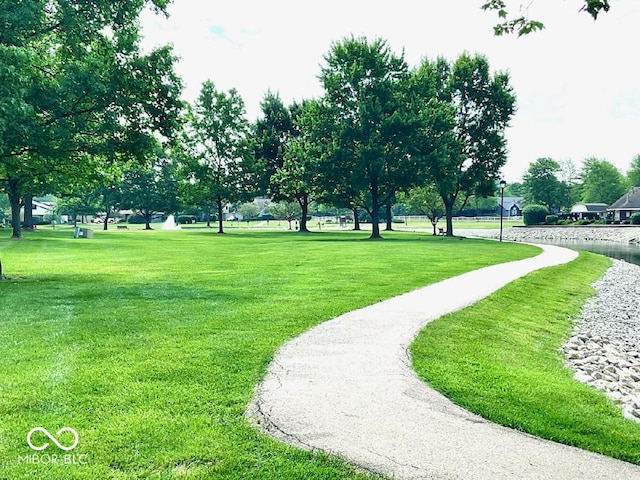 surrounding community featuring a yard