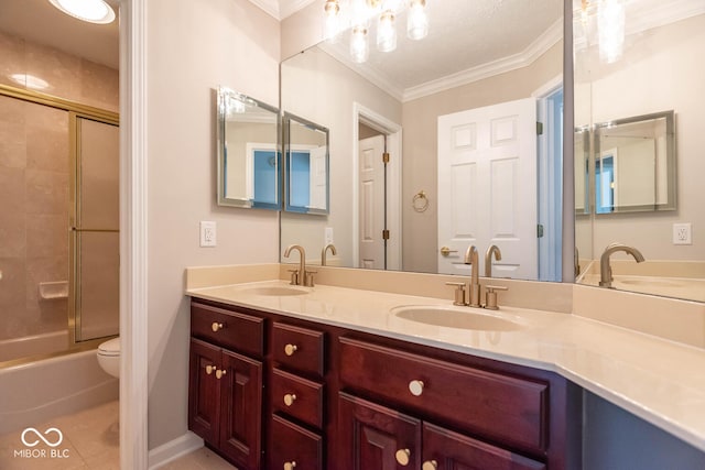 full bathroom with shower / bath combination with glass door, ornamental molding, toilet, tile patterned floors, and vanity