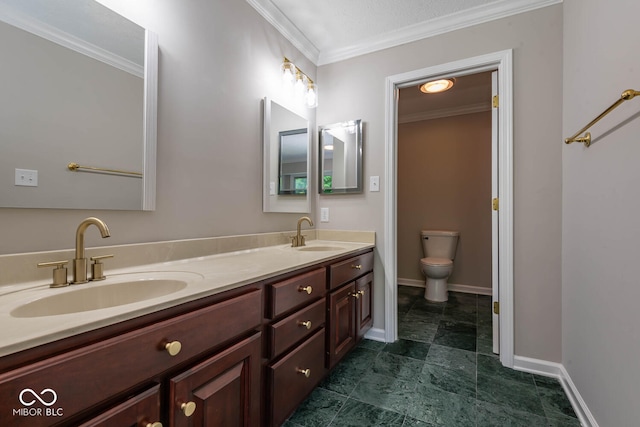 bathroom with toilet, crown molding, and vanity