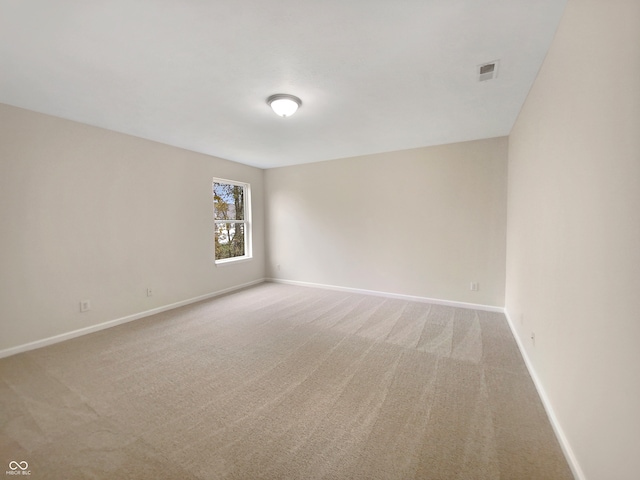 empty room featuring carpet flooring