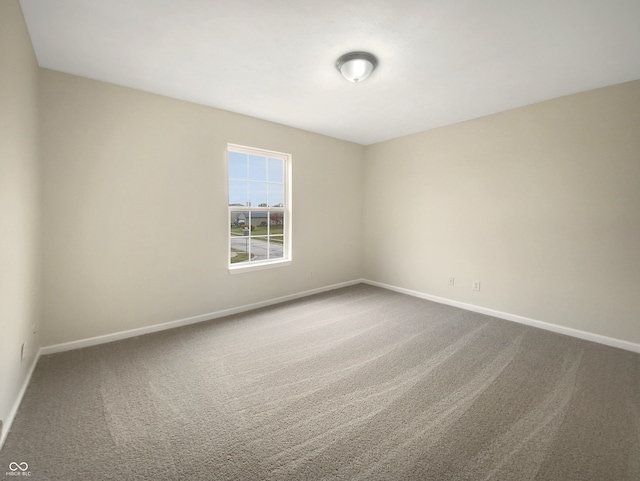 spare room featuring carpet