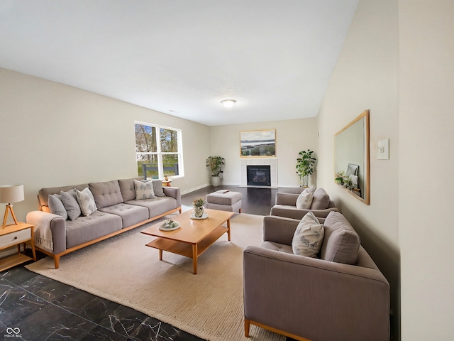 living room with a tiled fireplace