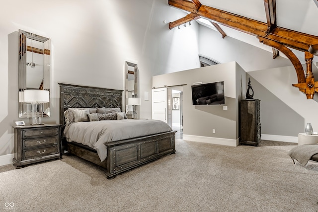 carpeted bedroom with beam ceiling and high vaulted ceiling