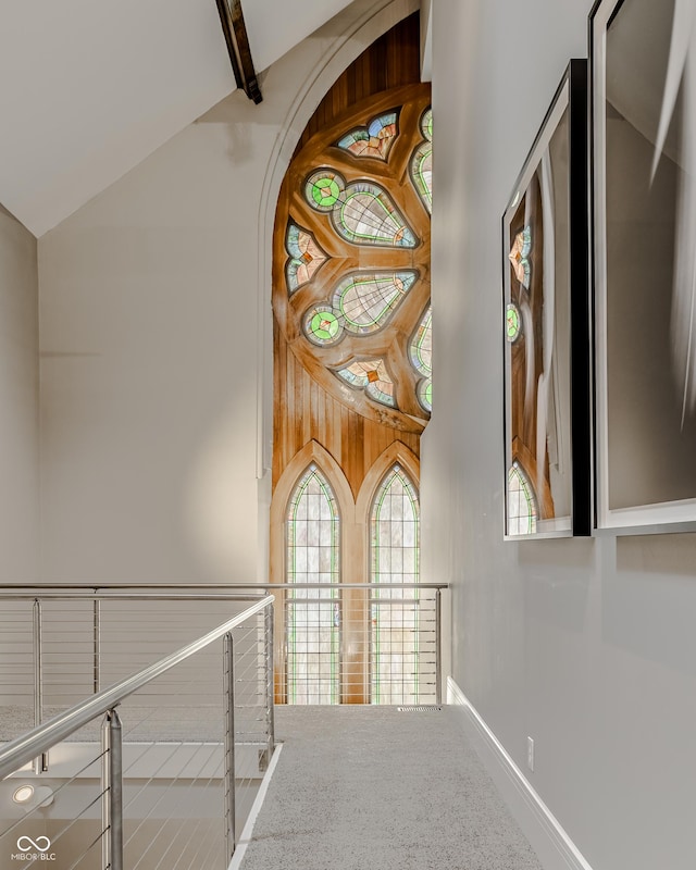 corridor with vaulted ceiling