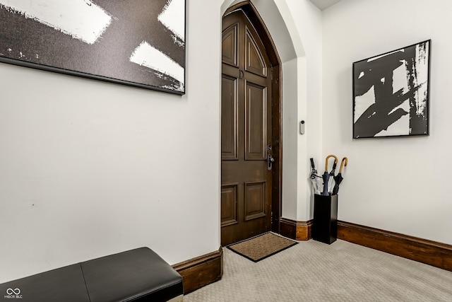 entryway with carpet floors