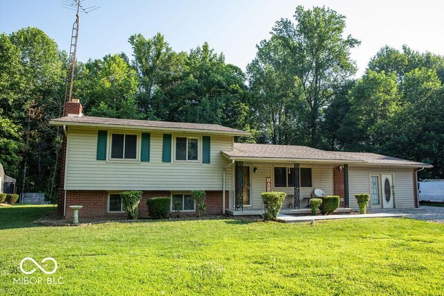10050 E State Road 250, Crothersville, IN 47229 - tri-level home with covered porch and a front yard