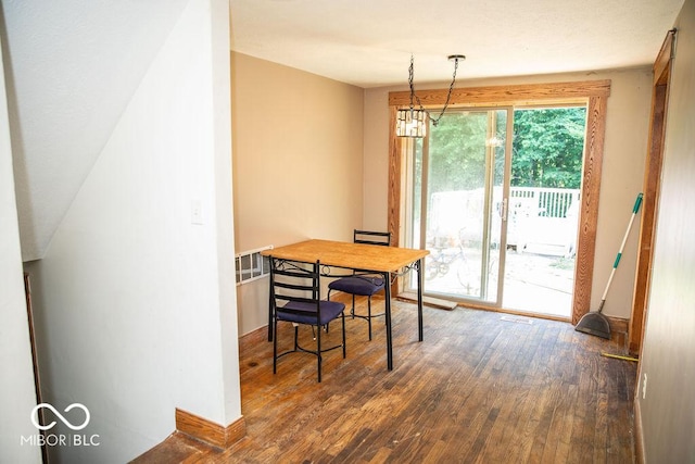 10050 E State Road 250, Crothersville, IN 47229 - dining area with a chandelier and dark hardwood / wood-style floors