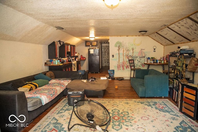 10050 E State Road 250, Crothersville, IN 47229 - living room featuring wood-type flooring, lofted ceiling, and a textured ceiling