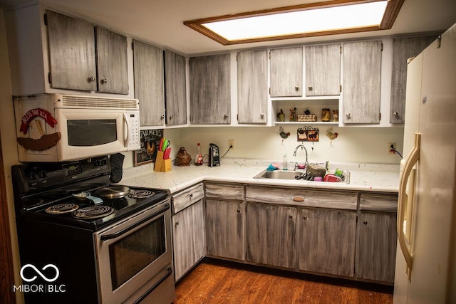 10050 E State Road 250, Crothersville, IN 47229 - kitchen featuring dark hardwood / wood-style flooring, white appliances, and sink
