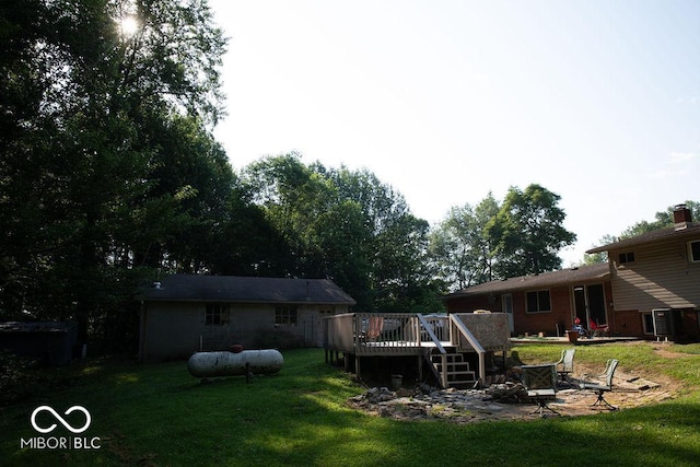 10050 E State Road 250, Crothersville, IN 47229 - view of yard featuring a deck and an outdoor fire pit