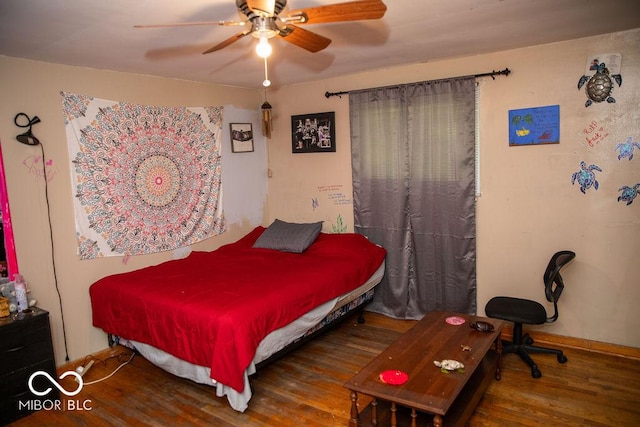 10050 E State Road 250, Crothersville, IN 47229 - bedroom featuring ceiling fan and dark hardwood / wood-style flooring