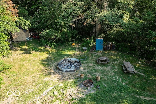 10050 E State Road 250, Crothersville, IN 47229 - view of yard with an outdoor fire pit and a storage shed
