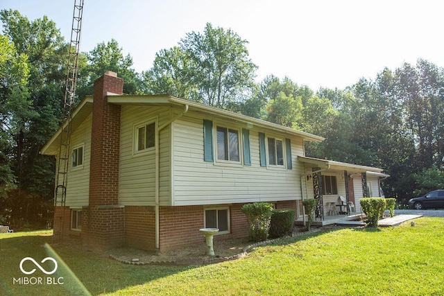 10050 E State Road 250, Crothersville, IN 47229 - view of front of property featuring covered porch and a front yard