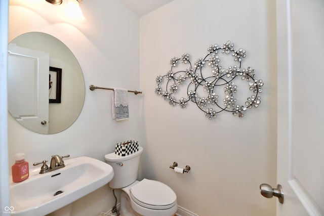 bathroom with sink and toilet