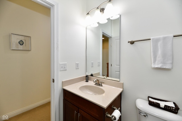 bathroom with toilet and vanity