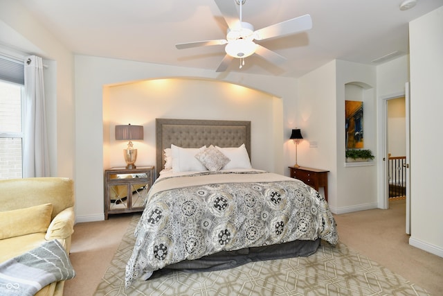 bedroom with ceiling fan and light carpet