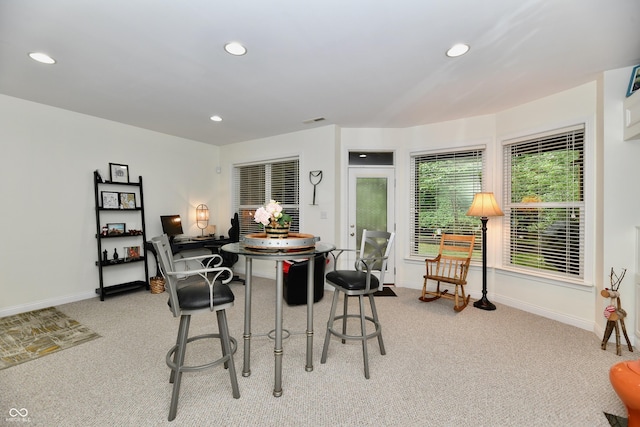 view of carpeted dining area