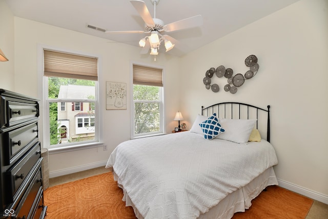 carpeted bedroom with ceiling fan