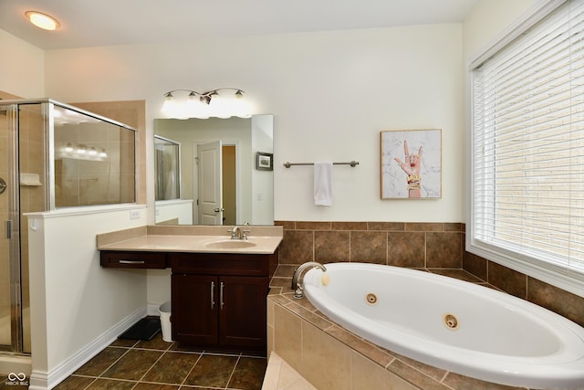 bathroom featuring tile patterned flooring, separate shower and tub, and vanity