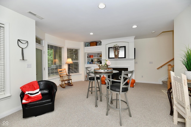 dining area with light carpet