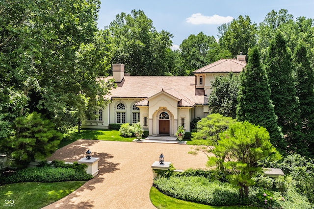 841 Alverna Dr, Indianapolis, IN 46260 - view of front of home featuring stucco siding and a chimney
